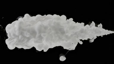 Macro of white ink being injected in water on black background