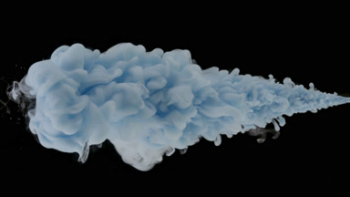 Macro of blue ink being injected in water on black background