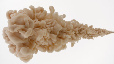 Macro of beige ink being injected in water on white background