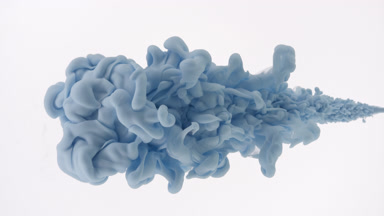 Macro of blue ink is being injected in water on white background