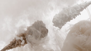 Brown and beige inks injected in cloudy water with beige stain