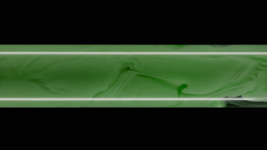 Macro shot of green ink inside test tube with water filling it