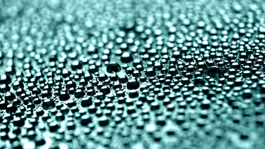 Water drops appear from shadow for a while on cyan background