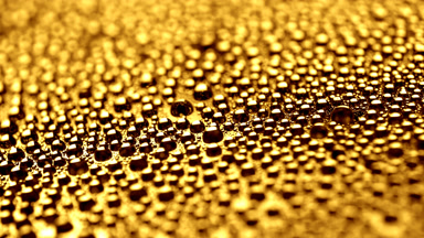 Water drops appear from shadow for a while on yellow background