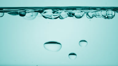 Bubbles float to the surface bouncing off it on cyan background