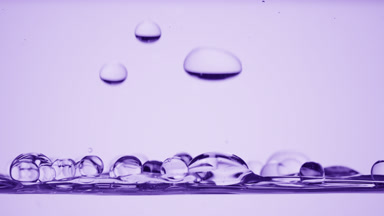 Bubbles float to surface bouncing off it on purple background