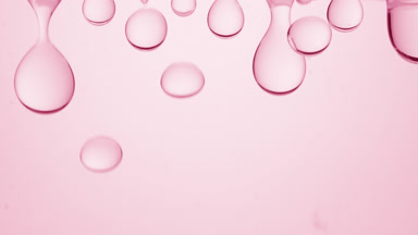 Pink transparent bubbles form and fall down on pink background