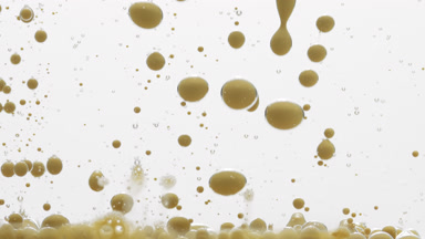 Macro of yellow opaque bubbles sink on grey background