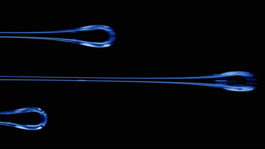 Macro of three flows of blue viscous liquid on black background