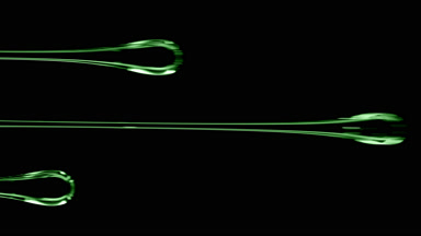 Macro of three flows of green viscous liquid on black background