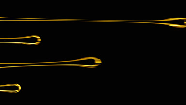 Four drops of yellow transparent viscous fluid flowing for while