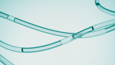 Lab connecting tubes with flowing liquid on cyan background