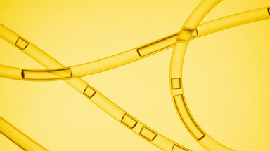 Yellow liquid flowing in connecting tubes on yellow background