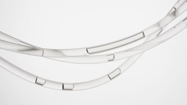 Grey liquid is flowing in three transparent lab connecting tubes