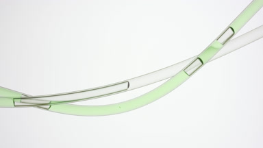 Green liquid flowing in two connecting tubes in same direction
