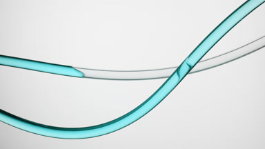 Cyan oil is filling lab connecting tube on grey background