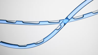 Blue oil is flowing in two connecting tubes on grey background