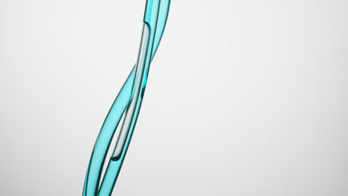 Cyan oil is flowing down in connecting tubes on grey background