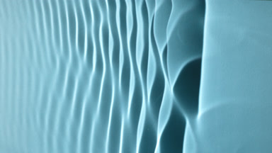 Macro shot of rippling water on blue background