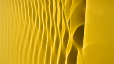 Macro shot of rippling water on yellow background