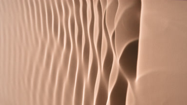 Macro shot of rippling water on beige background