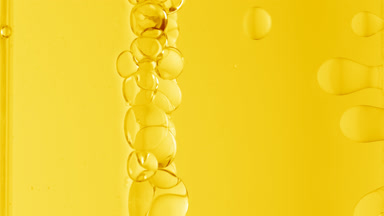 Yellow transparent bubbles form and float to another ones