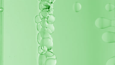 Green transparent bubbles form and float to another ones