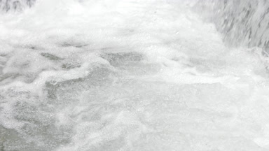 Mountain river water bubbling and foaming