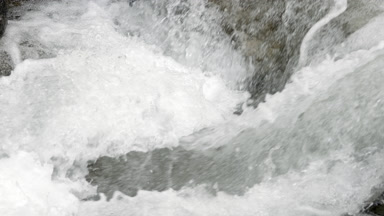 Mountain river water bubbling and foaming