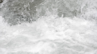 Mountain river water bubbling and foaming