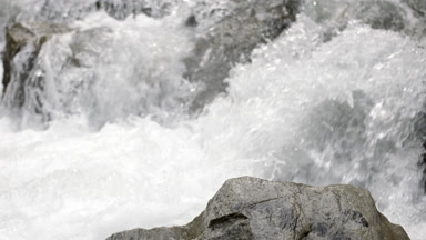 Mountain river water bubbling and foaming