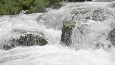 Mountain river water bubbling and foaming