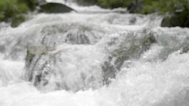Mountain river water bubbling and foaming