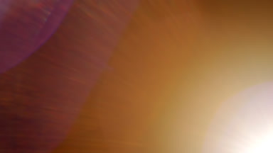 Diagonal warm light leak traveling spot ghosting & veiling
