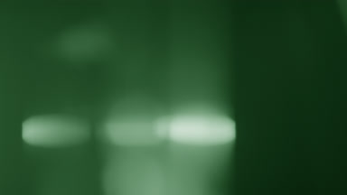 Green prism flare spot rises in light leak overlay