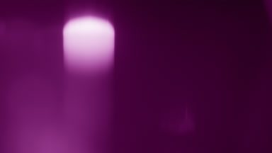 Pink prism flare spot rises vertically in overlay