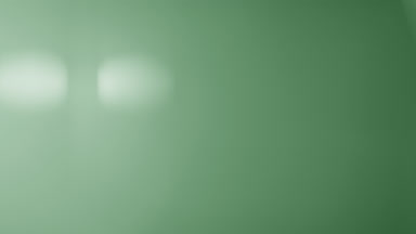 Green light leak veiling flare rises upward