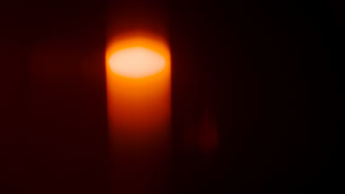 Warm orange light leak soft spot moves top to bottom
