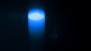 Cool blue light leak luminous spot moves vertically
