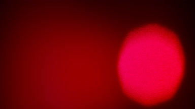 Red light leak overlay with vertical luminous spot