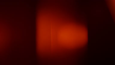 Warm light leak overlay glowing spot moves upward