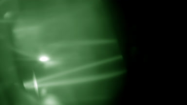 Green shimmering light leak overlay left side appears & fades