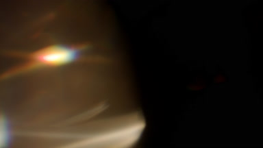 Neutral prism flare light leak overlay on left side