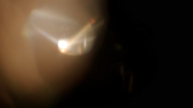 Neutral light leak overlay with left prism flare