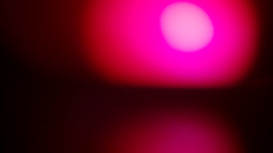 Red light leak overlay with random flashing luminous spot