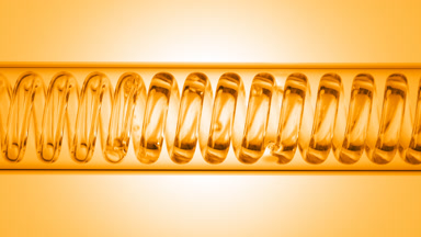 Honey water flowing through horizontal coil lab condenser