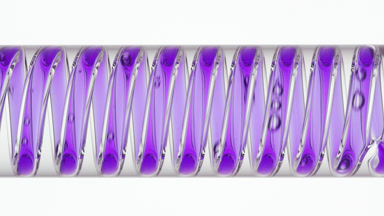 Purple liquid in coil condenser, cooling water, white background
