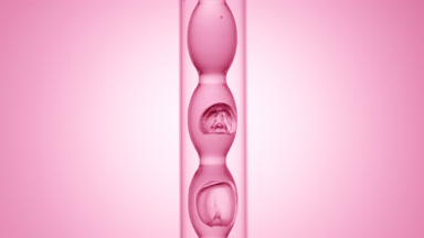 Pink transparent liquid in bulb condenser on pink ramp scene