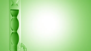 Green liquid drains from vertical bulb condenser, green ramp