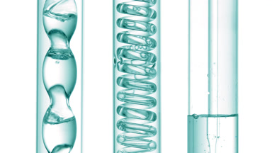 Clear liquid with bubbles in bulb condenser, white background